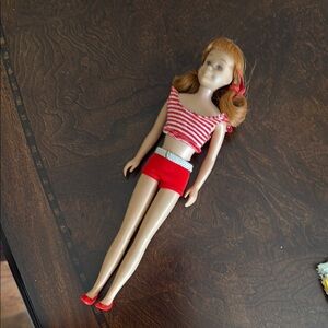 Barbie’s 1960’s Vintage Skooter doll wearing original swimsuit